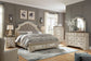 Realyn  Upholstered Bed With Mirrored Dresser And Chest