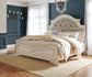 Realyn  Upholstered Panel Bed With Mirrored Dresser